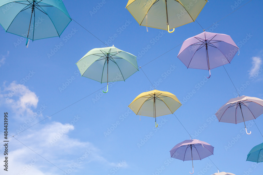 Colorful umbrellas background. Colorful umbrellas in the sky.