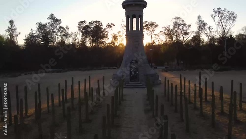 Gothic tower in park of Chapultepec forest Mexico City. Sunset in background with drone aerial view. latin couple in love, model running. Pretty cactus way photo