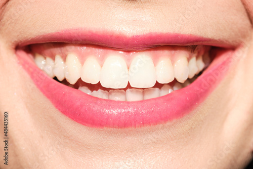 Anonymous woman with toothy smile