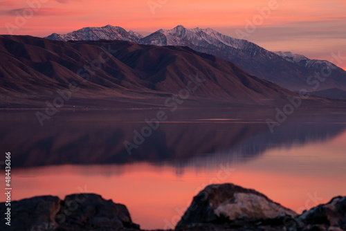 Nebo mountain reflecting in Utah Lake during colorful sunset