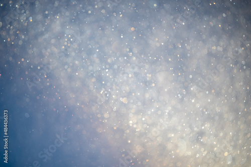 Frost and snow particles floating through the air in fog