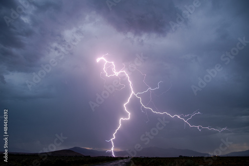 Lightning striking the ground during rain storm