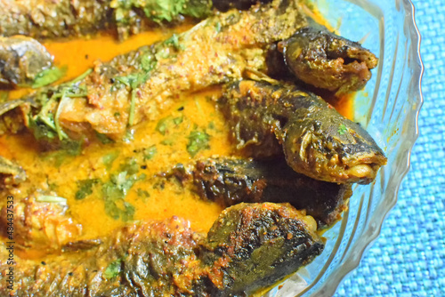 Tyangra fish , scientific name - Batasio batasio or Mystus tengara or Macrones vittalus, cooked and served in plate. These are very popular fishes in West Bengal (India). Bengalis love to eat them. photo