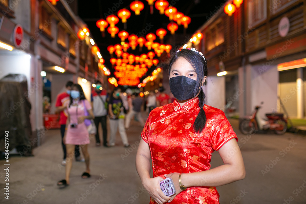 Asian woman wear red cheongsam dress. Chinese new year celebration concept. Asian woman wear red cheongsam dress. Chinese new year celebration concept.