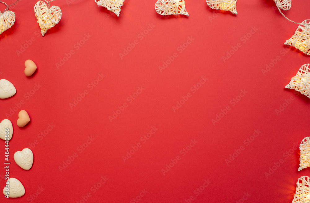 Heart-shaped soap and a beam of heart-shaped lights on a red background. Love valentine concept. Flat lay Heart-shaped soap and a beam of heart-shaped lights on a red background. Love valentine concept. Flat lay