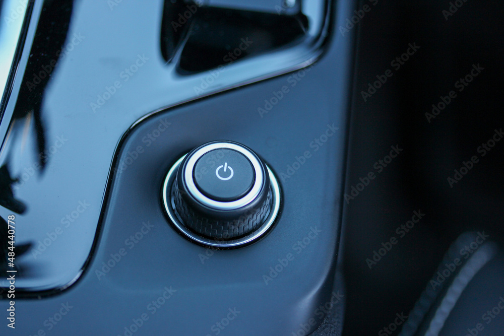 Power button on the center console of a new vehicle