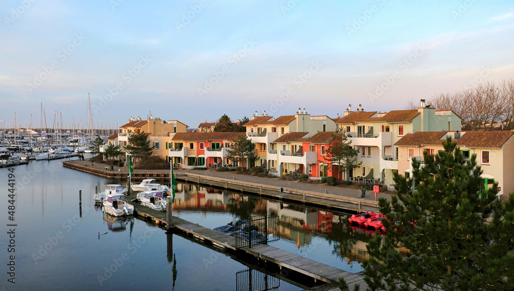 apartments at a sea harbour in the sunset