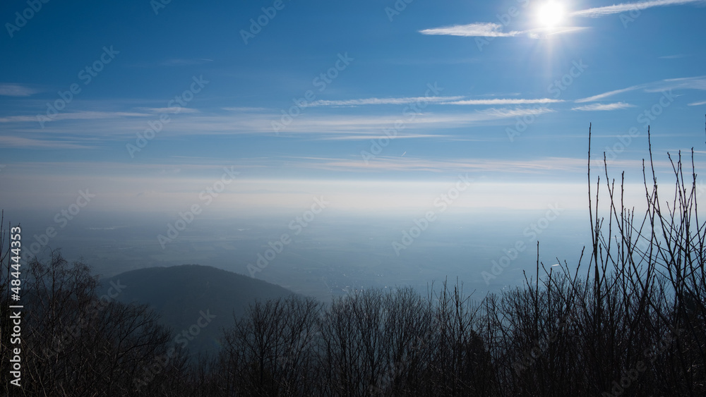 scenic view over Alsace plain under a blue sky and haze 