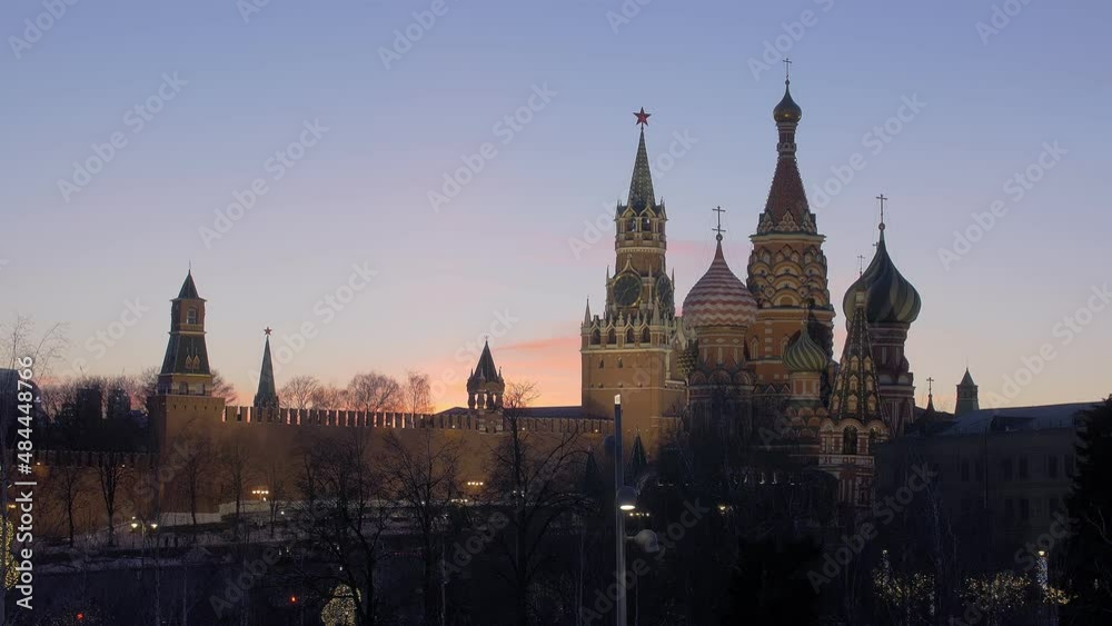 sunset in Moscow, St Basil Cathedral and Kremlin tower against beautiful colorful sky sunset in Moscow, St Basil Cathedral and Kremlin tower against beautiful colorful sky