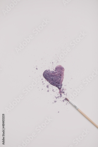 Heart symbol made of watercolor and paintbrush on white background. Valentine's Day, Woman Day composition