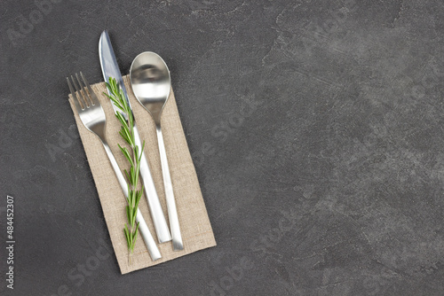 Set of cutlery on linen napkin. photo