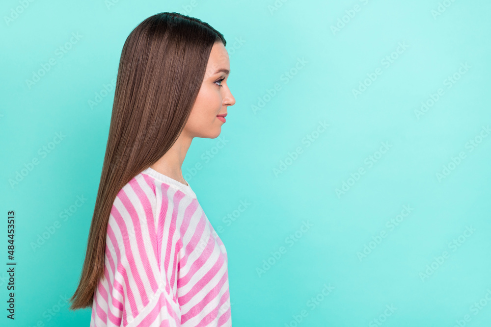 Profile side view portrait of attractive sweet tender brunet girl copy space ad isolated over bright teal turquoise color background