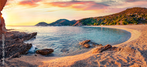 Panoramic summer view of Cheromylos beach. Splendid sunrise on Euboea island, Greece. Calm Aegean seascape. Beauty of nature concept background.