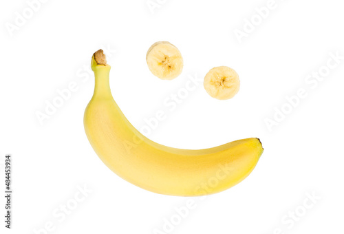 Happiness and joy. The food for dessert is delicious and delicious. Banana smile. Emotional expression banana fruit on a white background.