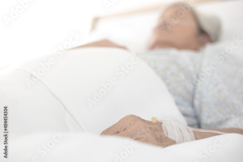 closeup hand of old patient woman , wrinkle skin , solution treatment prepare, palliative care
