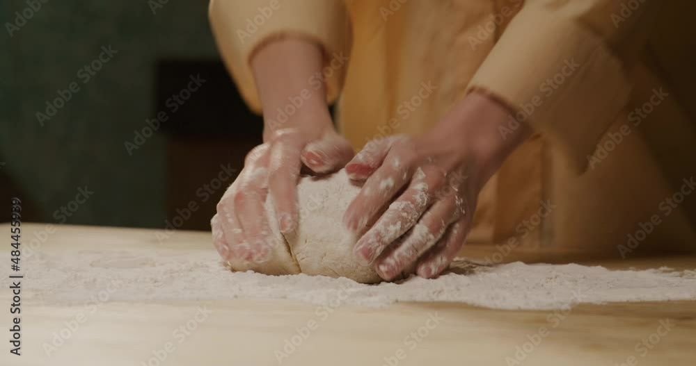 kneading dough for pizza with hands flour baking pastry at home.