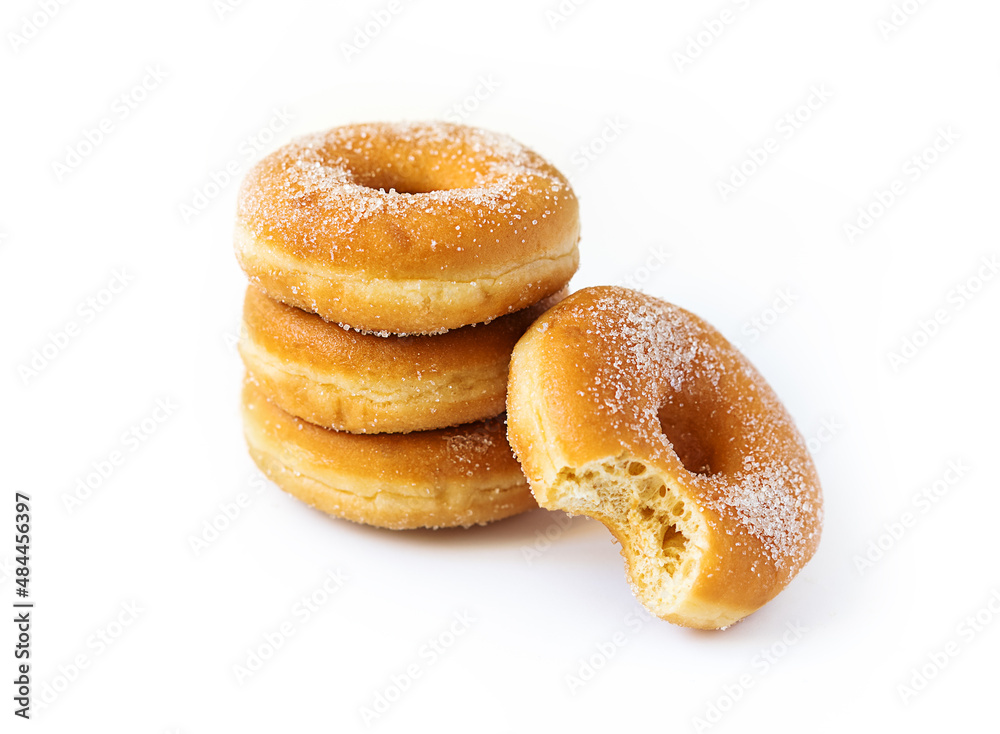 Isolated doughnuts, one of them is bitten
