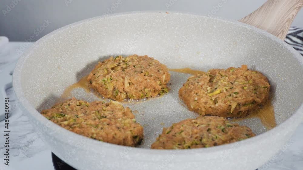 Step by step. Frying zucchini cakes in olive oil on a small frying pan. Step by step. Frying zucchini cakes in olive oil on a small frying pan.