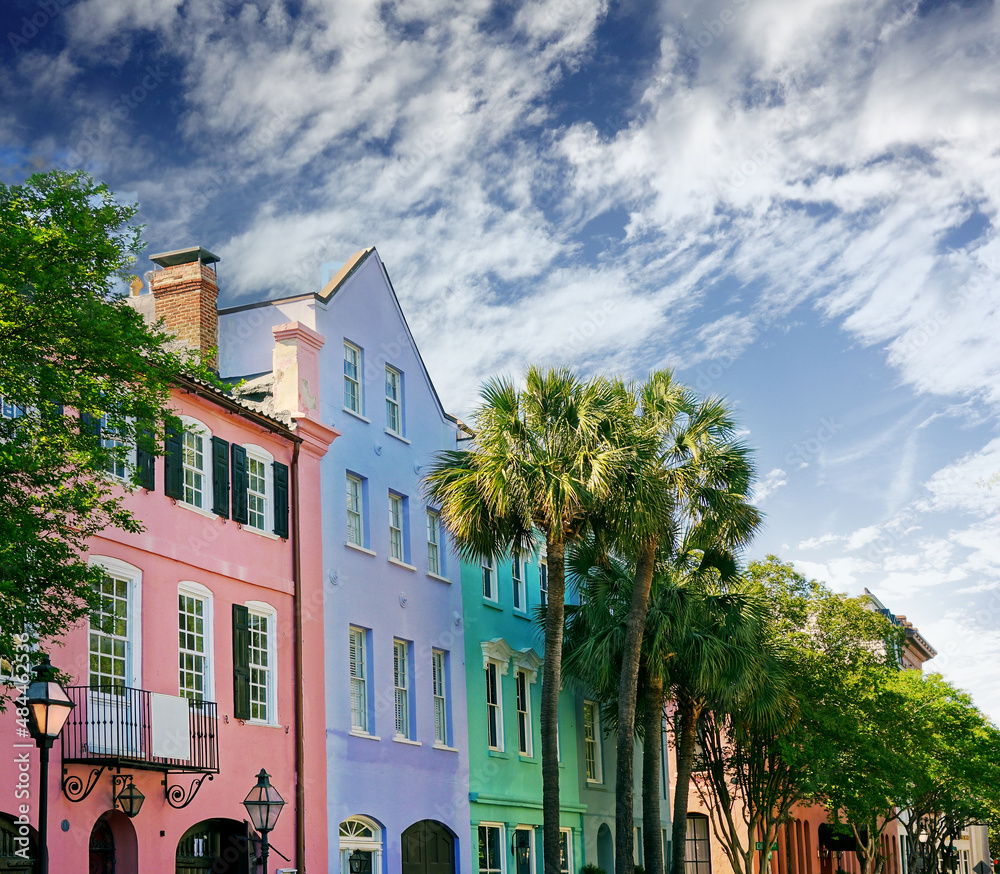 Naklejka premium Brightly painted homes known as Rainbow Row on East Bay St in Charleston SC