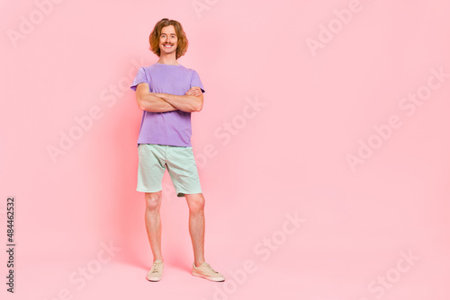 Full length body size view of attractive content cheerful funky guy folded arms isolated over pink pastel color background