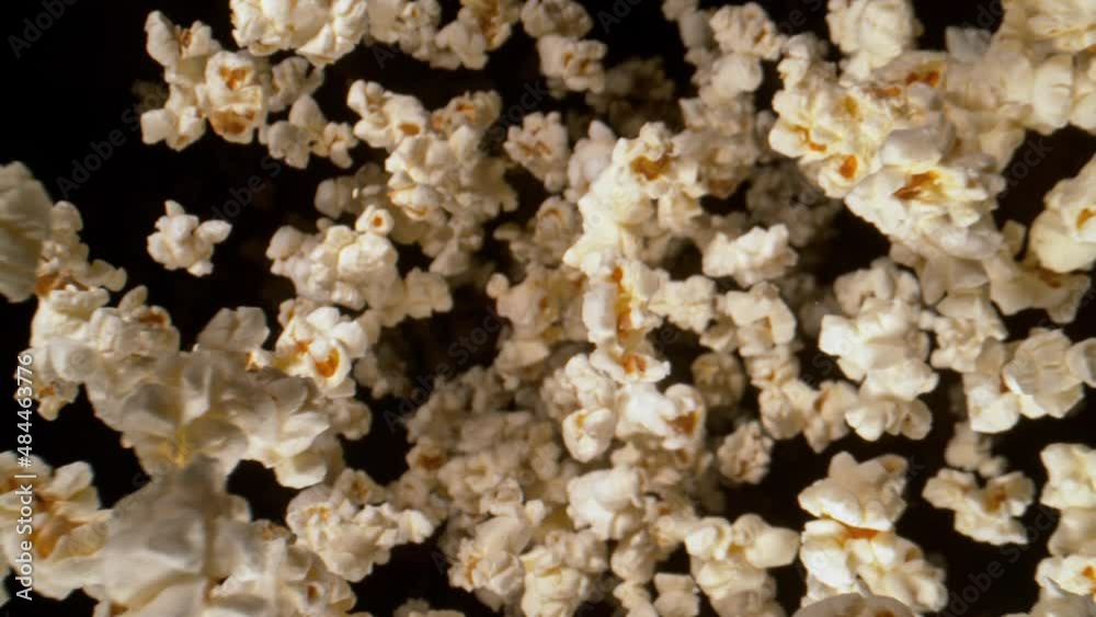 Super Slow Motion Shot of Fresh Fluffy Popcorn Flying Towards the Camera at 1000fps. Super Slow Motion Shot of Fresh Fluffy Popcorn Flying Towards the Camera at 1000fps.