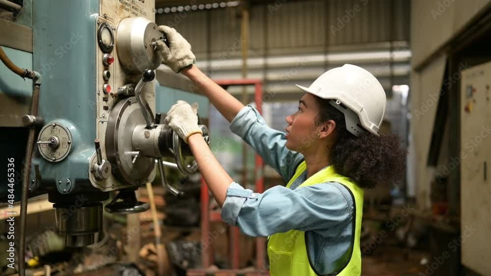 Female chief mechanical engineer working in a mechanical factory, Check and preventive maintenance after heavy use. Female chief mechanical engineer working in a mechanical factory, Check and preventive maintenance after heavy use.