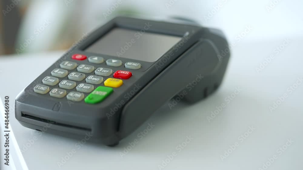 Woman paying with contactless credit card. Wireless money transaction. Wireless payment Woman paying with contactless credit card. Wireless money transaction. Wireless payment