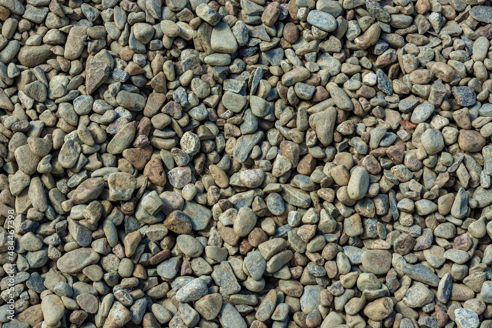 Fragment of the surface of small gray stones for use as an abstract background and textures. Fragment of the surface of small gray stones for use as an abstract background and textures.