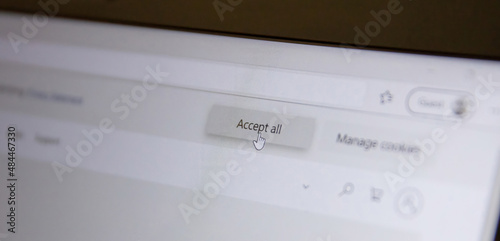 Accept all message on a computer screen, closeup view. Accept cookies, changes, email address photo