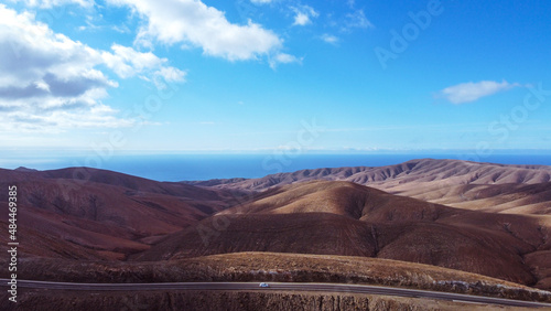 Panoramic view with mountain, desert and road in Fuerteventura