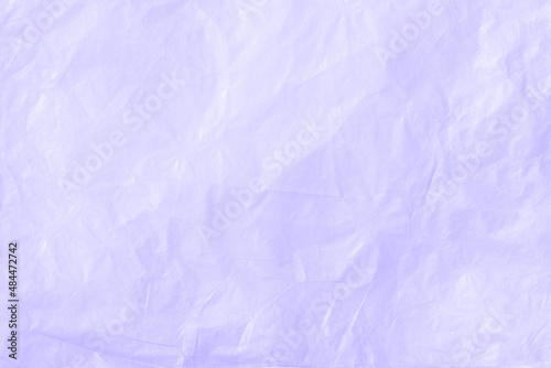 Crumpled kraft paper or cardboard texture for purple background