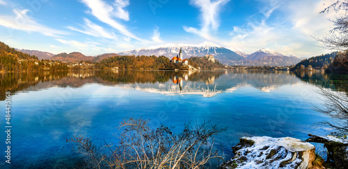 Lake Bled, Slovenia. Beautiful mountain lake with small Pilgrimage church and mountain range