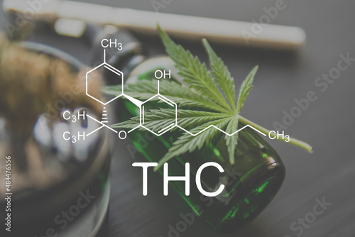 THC chemical formula. Cannabis with the tetrahydrocannabinol molecule. photo