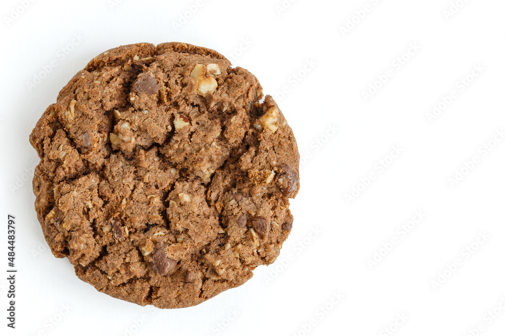 Cookies with chocolate and nuts are highlighted on a white background. Flat lying. Cookies with chocolate and nuts are highlighted on a white background. Flat lying.