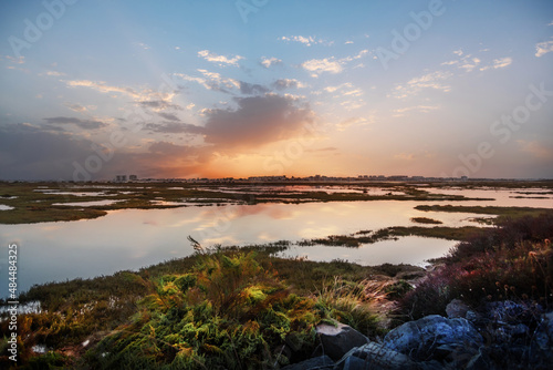 Fotografia View of Punta Umbria from the marshes of Huelva Spain, in a beautiful sunset wit