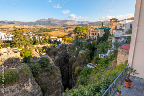 View of the less photographed side of the Old Bridge and canyon in the historic town of Ronda, Spain