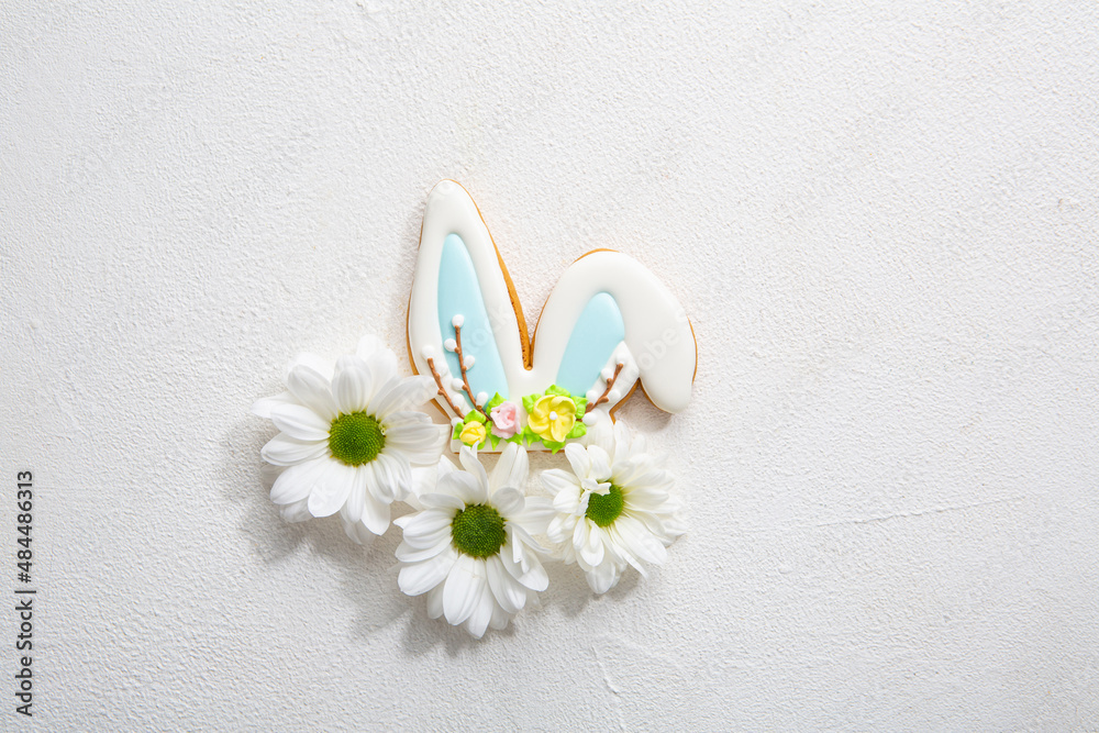 Easter bunny cookies and white flowers spring concept Easter bunny cookies and white flowers spring concept