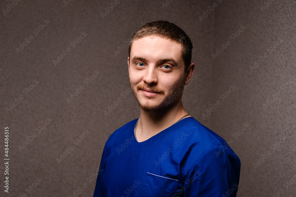Portrait of a young doctor in a blue uniform Portrait of a young doctor in a blue uniform