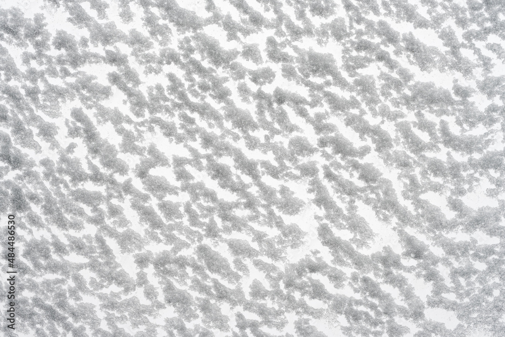 White snow texture. Snow-covered glass bottom view. Christmas and New Year background.