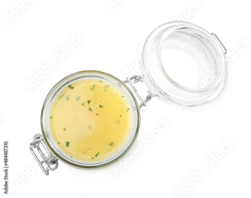 Jar with lemon sauce on white background, top view. Delicious salad dressing