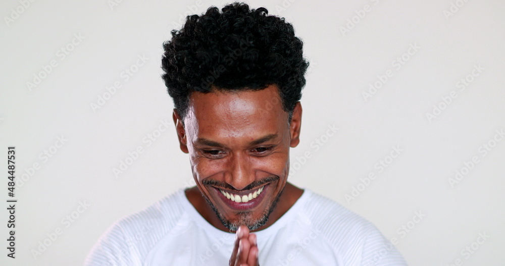 African man receiving good news feeling happy. Smiling joyful black person celebrating success African man receiving good news feeling happy. Smiling joyful black person celebrating success