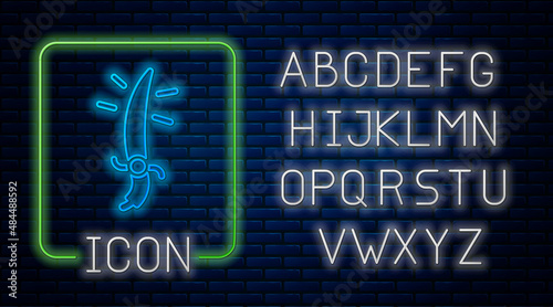 Glowing neon Arabian saber icon isolated on brick wall background. Neon light alphabet. Vector