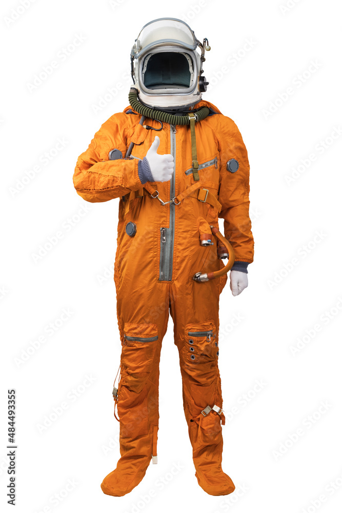 Astronaut wearing an orange spacesuit and helmet showing thumbs-up gesture isolated on white background