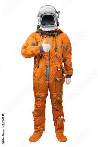 Astronaut wearing an orange spacesuit and helmet showing thumbs-up gesture isolated on white background