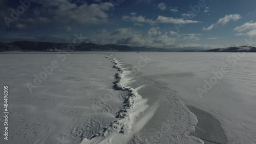 Drove flying over crack in frozen lake