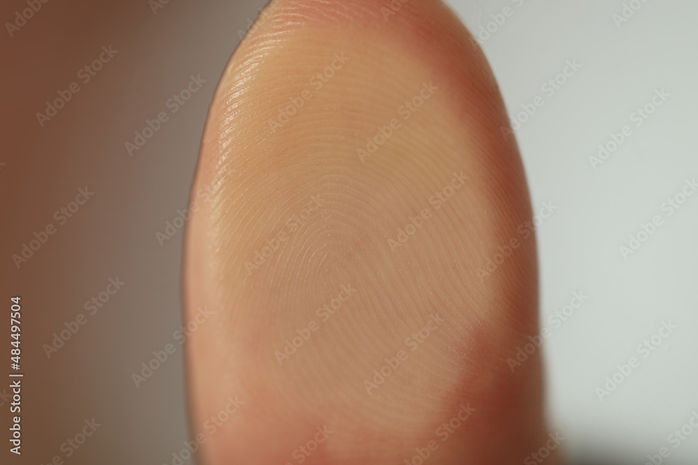 Fototapeta premium Closeup view of person scanning fingerprint on blurred background