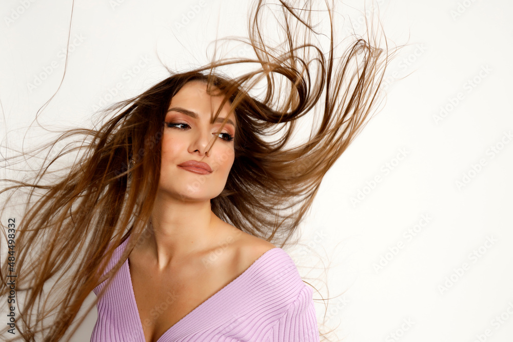 Fototapeta premium Attractive brunette girl is posing in studio. Style, trends, fashion concept.