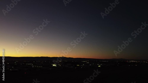 Drone shot of sunset over town