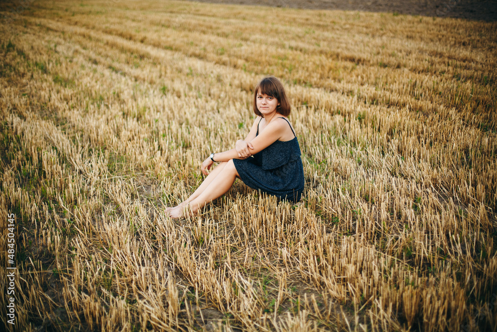 A beautiful girl and a field on which they threshed grain. Woman after harvest. Girl and yellow field
A beautiful girl and a field on which they threshed grain. Woman after harvest. Girl and yellow field