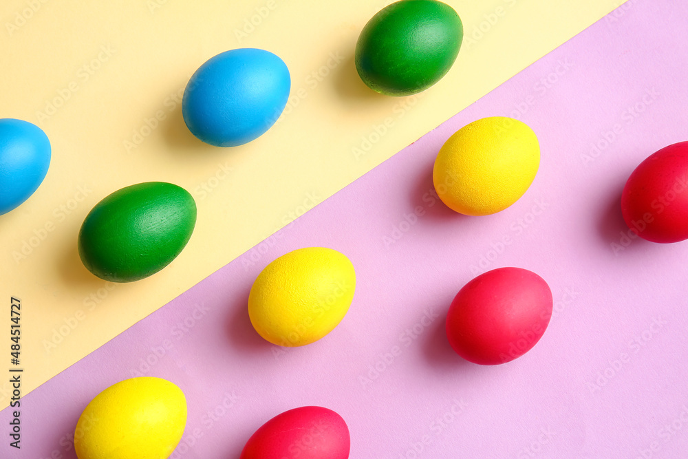 Multicolored Easter eggs on color background